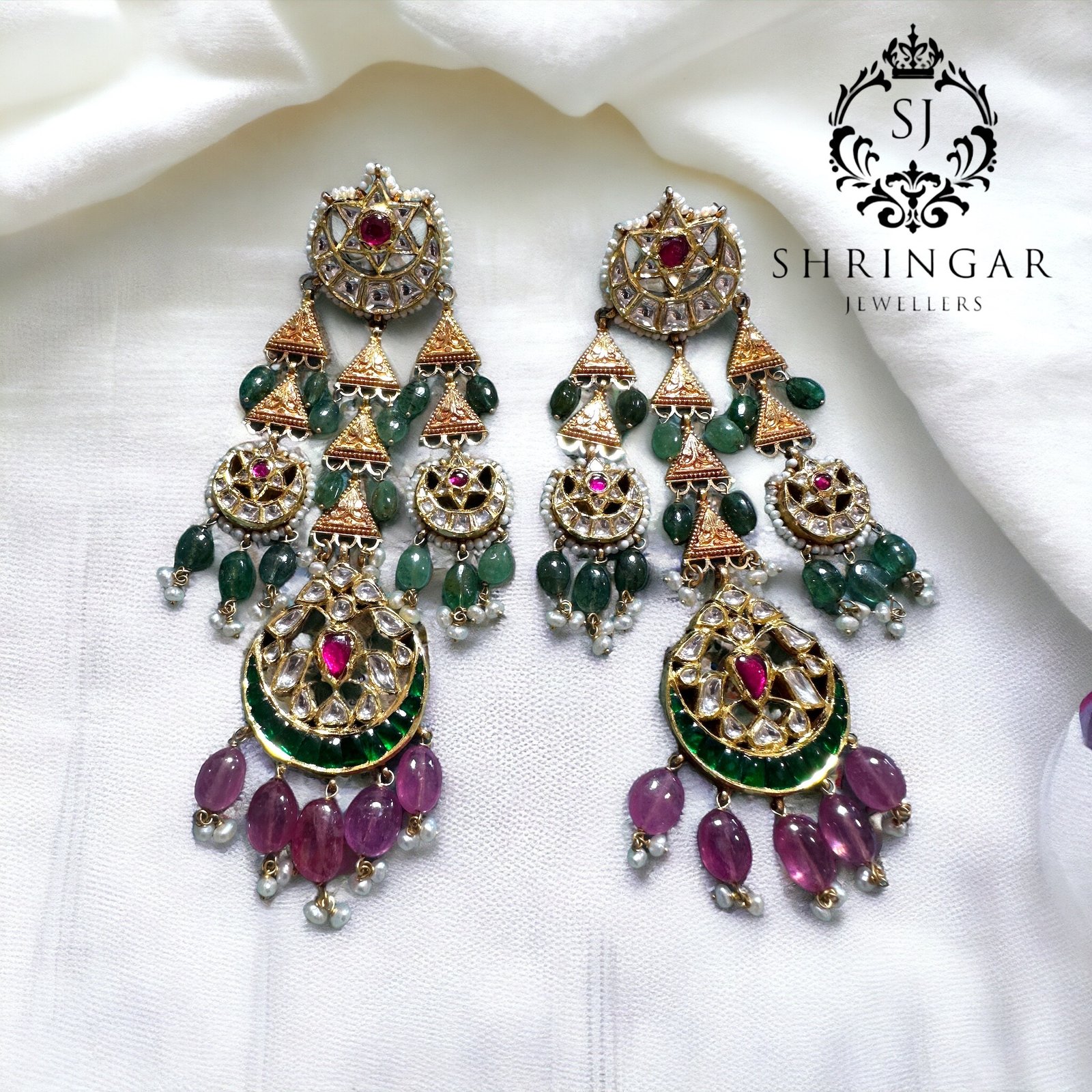 Rajasthani traditional earrings studded in ruby ,emeralds and in Kundan stones handmade in 22 karat gold