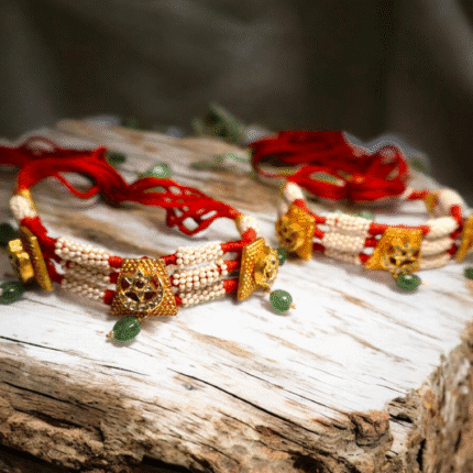 Add a royal charm to your look with this traditional Rajasthani bhujband, handcrafted in 22Kt gold and studded with radiant Kundan stones.