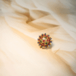 Rakhri in ruby, emerald, diamond polkis, and Basra pearls – handcrafted traditional Indian head ornament