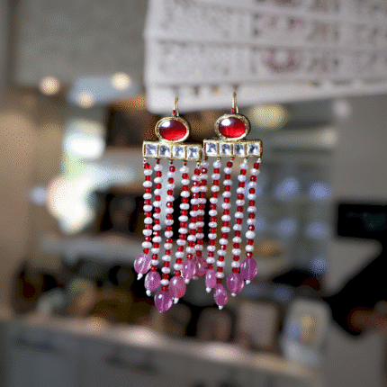 **Short Description:** Handcrafted in 22kt gold, these elegant earrings feature traditional Kundan stones, vibrant rubies, and freshwater pearls
