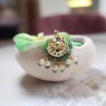 Handcrafted Besar with emeralds, cultured pearls, and Kundan stones – traditional Indian nose ring in gold