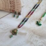 22kt gold pendant set with earrings featuring rose-cut diamond polkies, multi-color sapphire, emerald & ruby strings, and front-back enamelling.