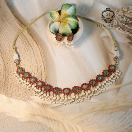 22kt gold jewelry set with earrings, studded in natural rubies, emeralds, and cultured pearls, traditional handcrafted design.