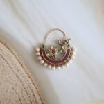 Gold Nath adorned with diamond polkies, freshwater pearls, rubies, and emeralds – handcrafted traditional Indian nose ring for bridal or festive wear.