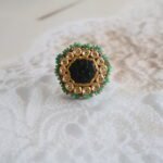 22kt gold ring with carved emeralds and diamond polkies, handcrafted with traditional detailing and vintage finish.