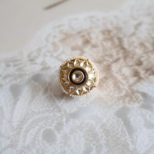 Rakhri with Kundan stones and freshwater pearls, handcrafted in traditional floral design for bridal and festive wear.