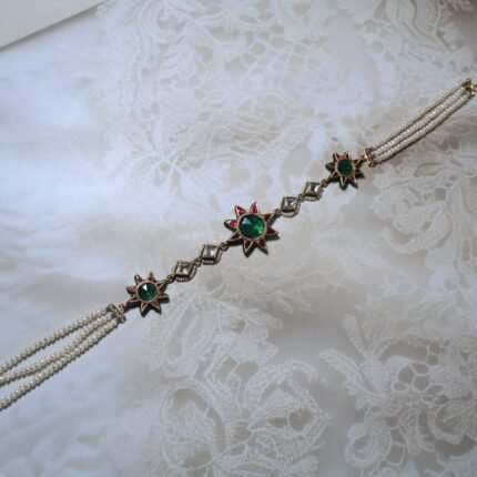 Handcrafted in 22kt pure gold, this Shishphool is embellished with freshwater pearls and Kundan stones, reflecting royal artistry. A perfect choice for brides and festive occasions.